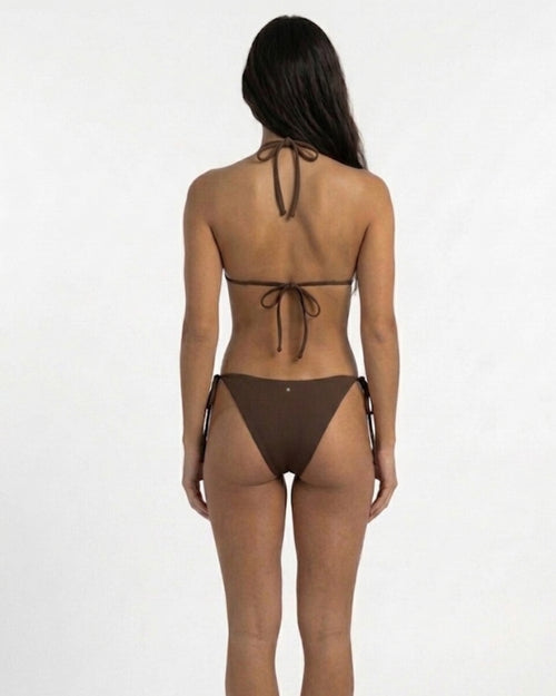 brunette model wearing the SUHN Swim maui brown relax triangle bikini. back view